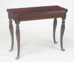 A George III Irish mahogany card table, the D-shaped fold-over top having a reeded edge and on