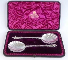 A cased pair of Victorian silver apostle spoons, having shell cast bowls, half-figural and