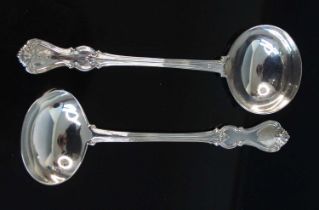 A pair of Victorian silver soup ladles, in the Albert pattern with engraved eagle armorial to the