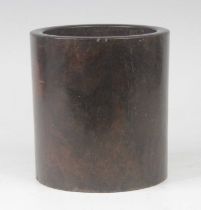 A Chinese hardwood brush pot, of plain cylindrical form, h.15.5cm Quite scratched.Some nibbles to