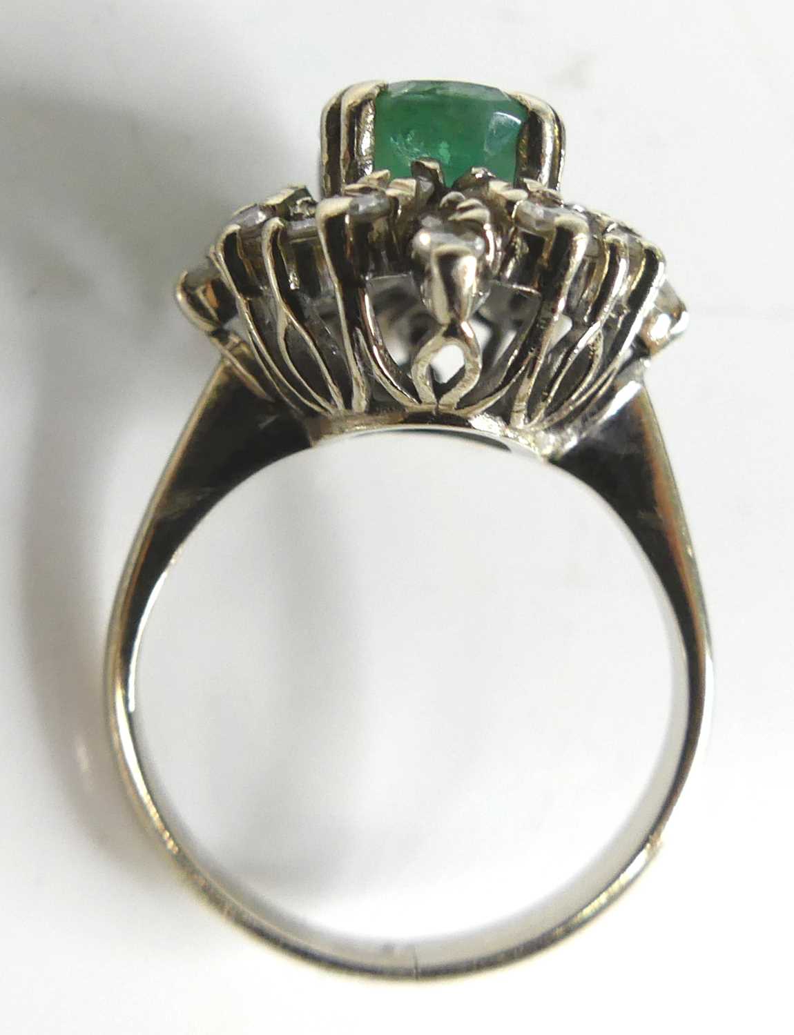 A white metal, emerald and diamond oval cluster ring, comprising a centre oval emerald within a - Image 5 of 7