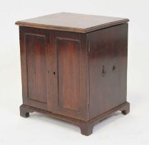 A 19th century mahogany table-top cabinet, having a hinged cover opening to reveal partitioned