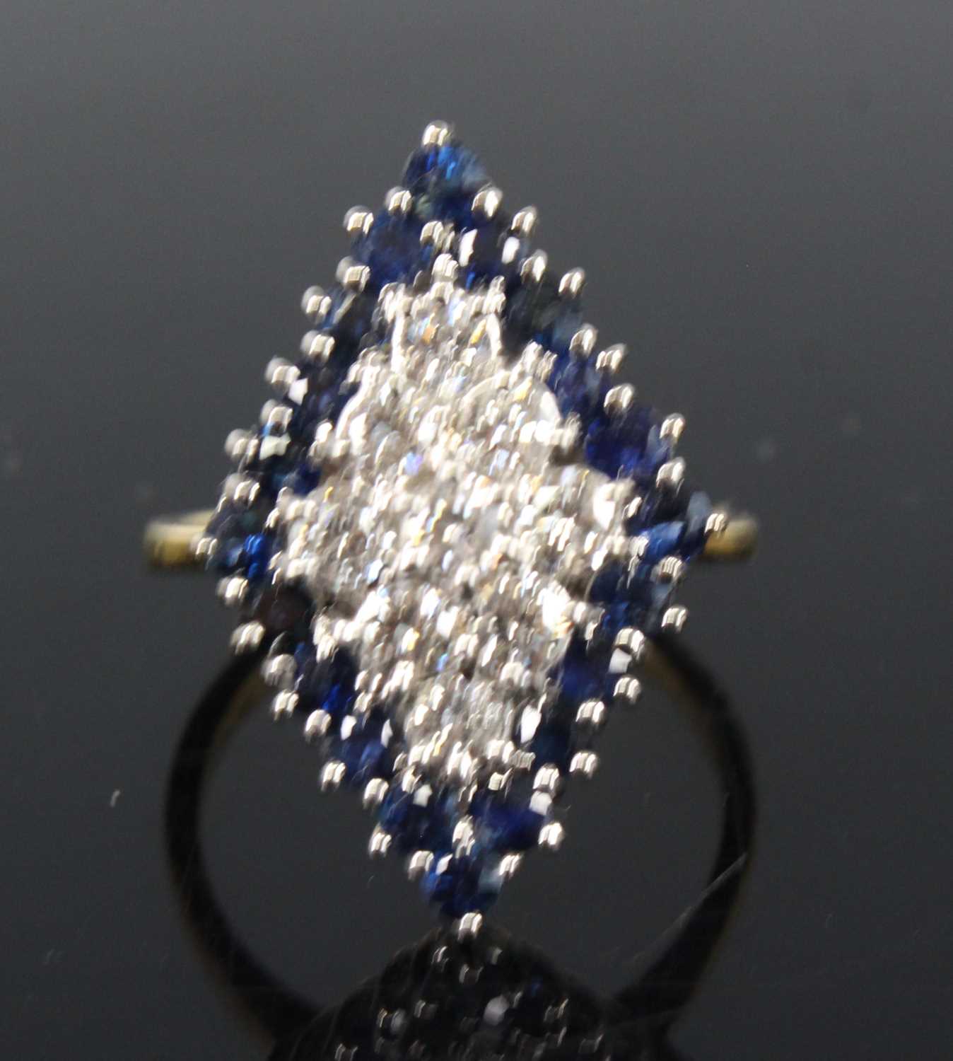 An 18ct yellow and white gold, sapphire and diamond navette shaped cluster ring, comprising a centre - Image 2 of 4