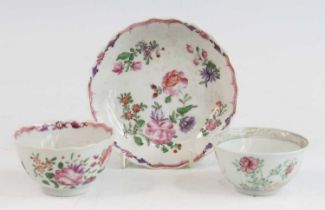 A Chinese famille rose porcelain tea bowl and saucer, 18th century, enamel decorated with flowers,