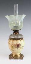 A Royal Worcester oil lamp, circa 1893, the vaseline glass shade above a clear glass font, the blush