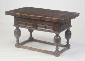 An antique continental oak drawleaf refectory table, having a planked top with cleated ends and