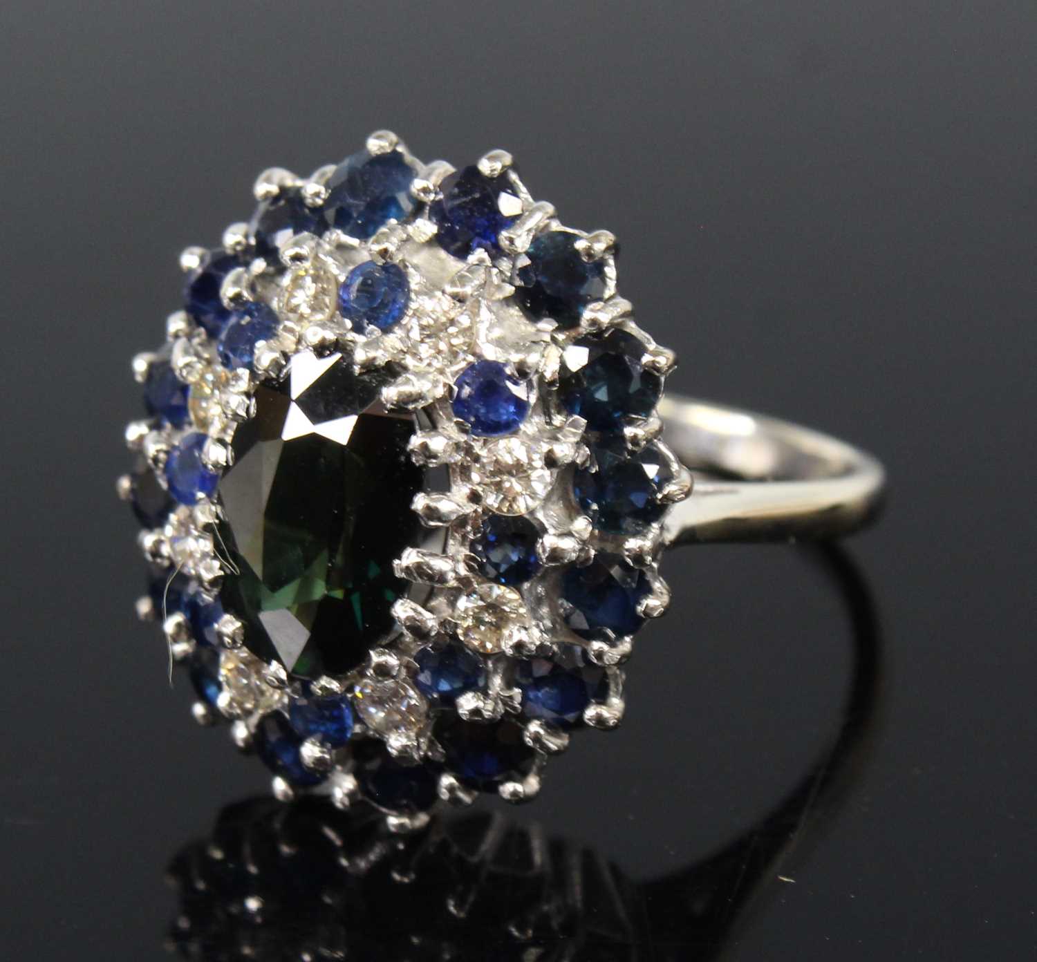 An 18ct white gold, sapphire and diamond oval cluster ring, featuring a centre oval sapphire - Image 2 of 4