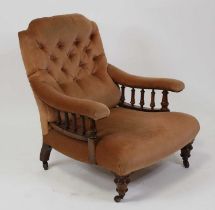 A late Victorian walnut framed library armchair in the manner of Howard & Sons, the whole re-