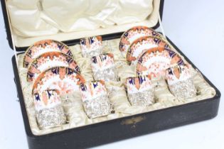 A cased set of six Edwardian Royal Crown derby coffee cans and saucers, each decorated in the