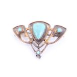 An appealing Art Nouveau turquoise and yellow metal brooch, having a shield shaped turquoise,