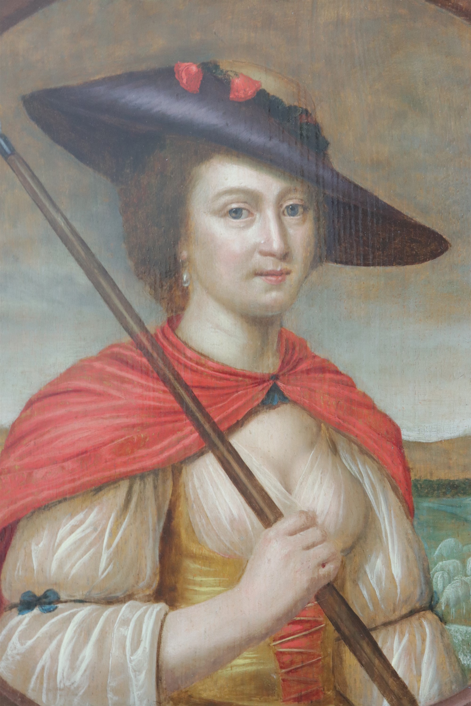 An 18th Century portrait of a lady as a shepherdess, oil on oak panel, restored, unsigned, in a