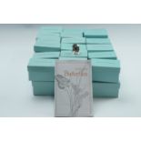 A quantity of World of Butterflies collector's thimbles and display stand