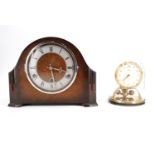 A 1930s oak cased mantle clock, striking and chiming on gongs, and a German Kundo torsion clock,