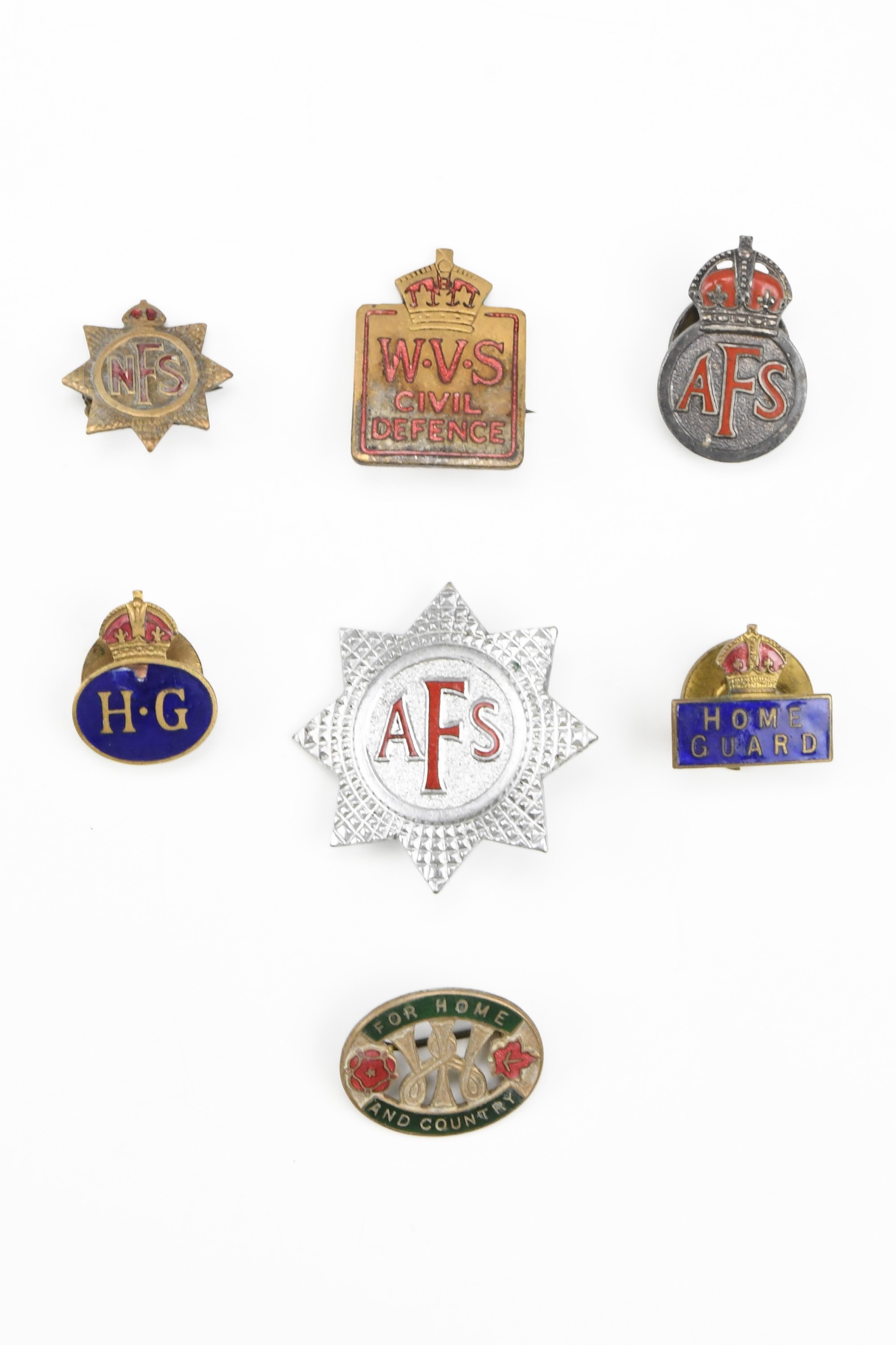 Two Second World War Home Guard lapel badges together with WVS Civil Defence, NFS, AFS Women's