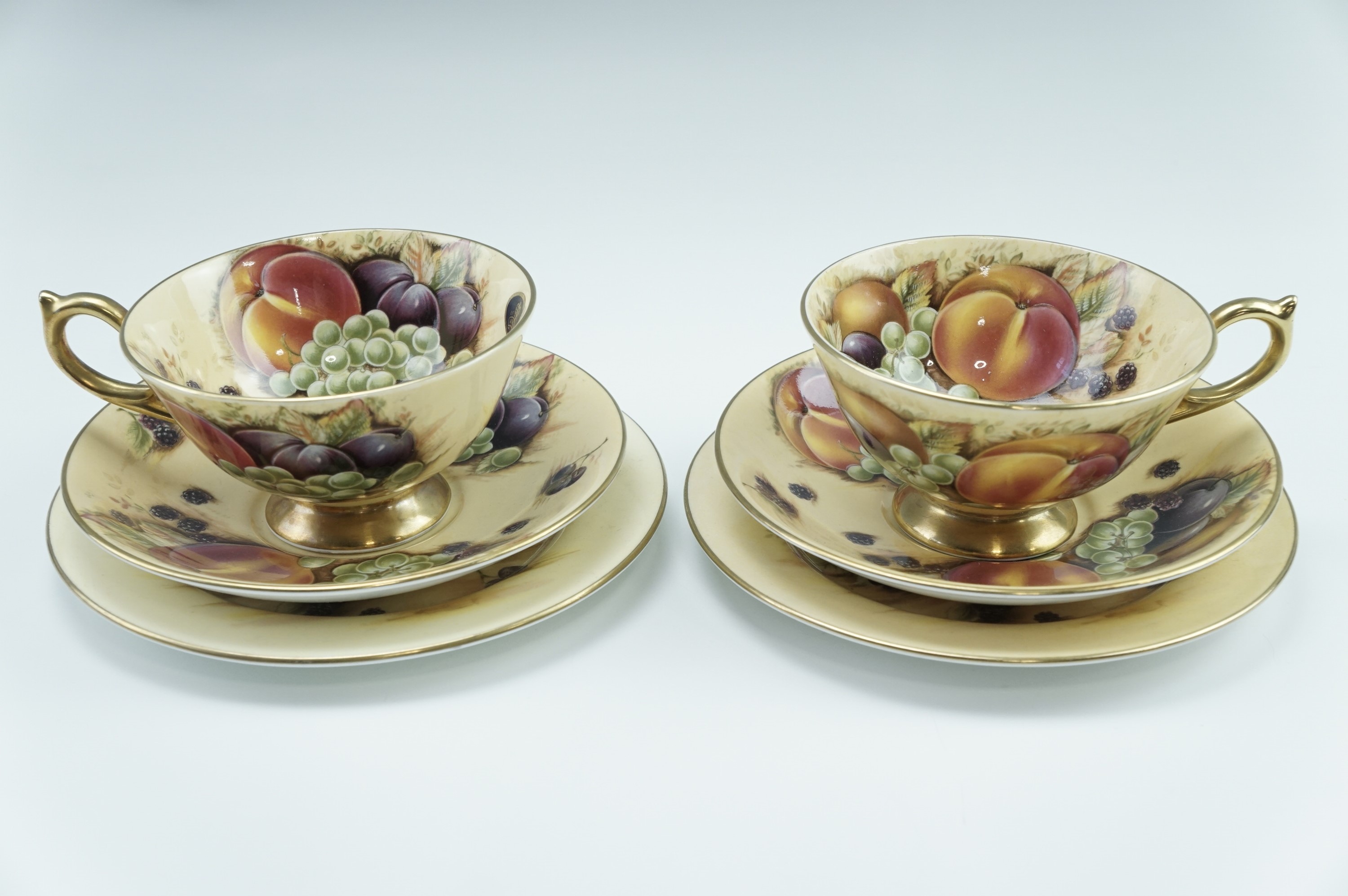 Two Aynsley Orchard Gold tea trios, transfer decorated with fruit, late 20th Century, cup 10.5 x 6 - Image 2 of 2