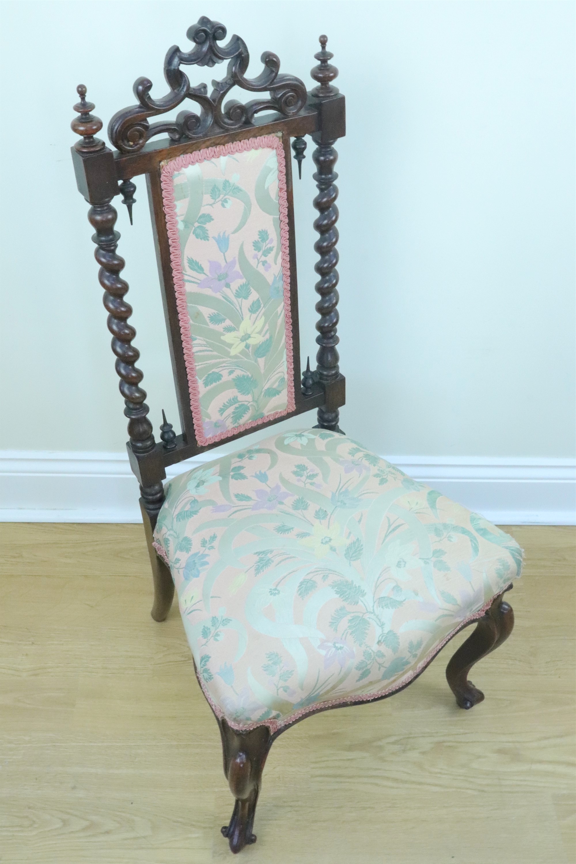 An Victorian carved walnut nursing chair with an adorsed barley twist back crested by a pierced - Image 2 of 2