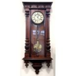 An early 20th Century single train walnut Vienna regulator, having a weight driven movement and an