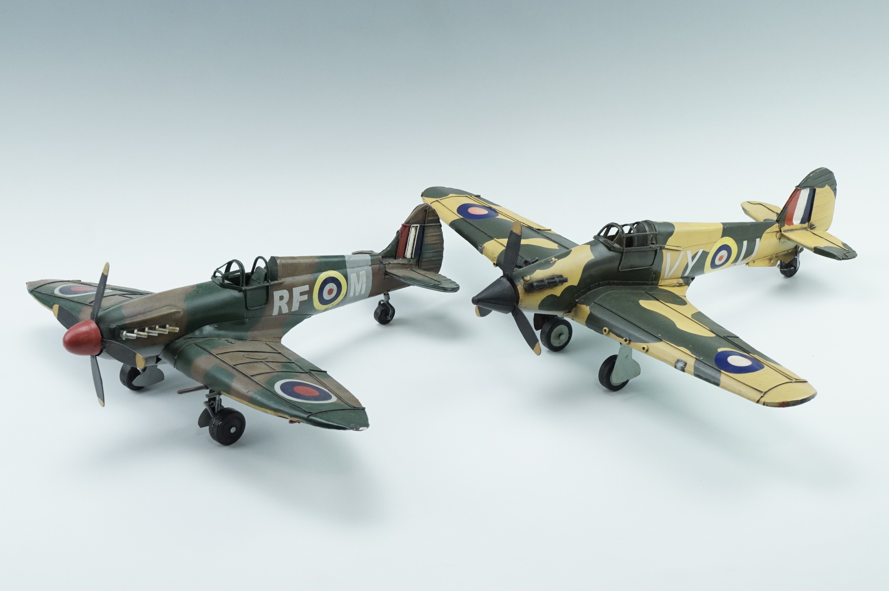 Two vintage tinplate style models of a Spitfire and a Hurricane, 43 cm