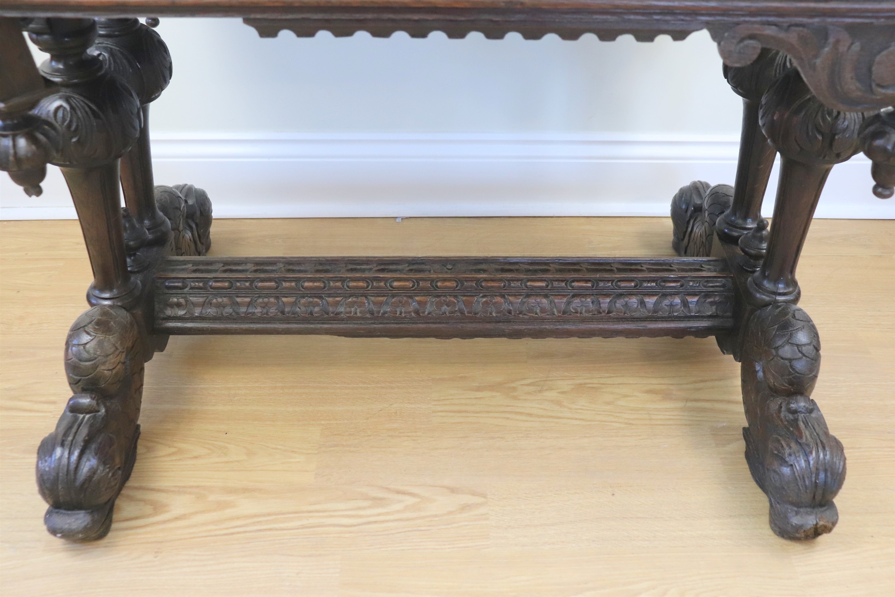 A late 19th / early 20th Century Flemish style heavily carved oak writing table, decorated overall - Image 3 of 3