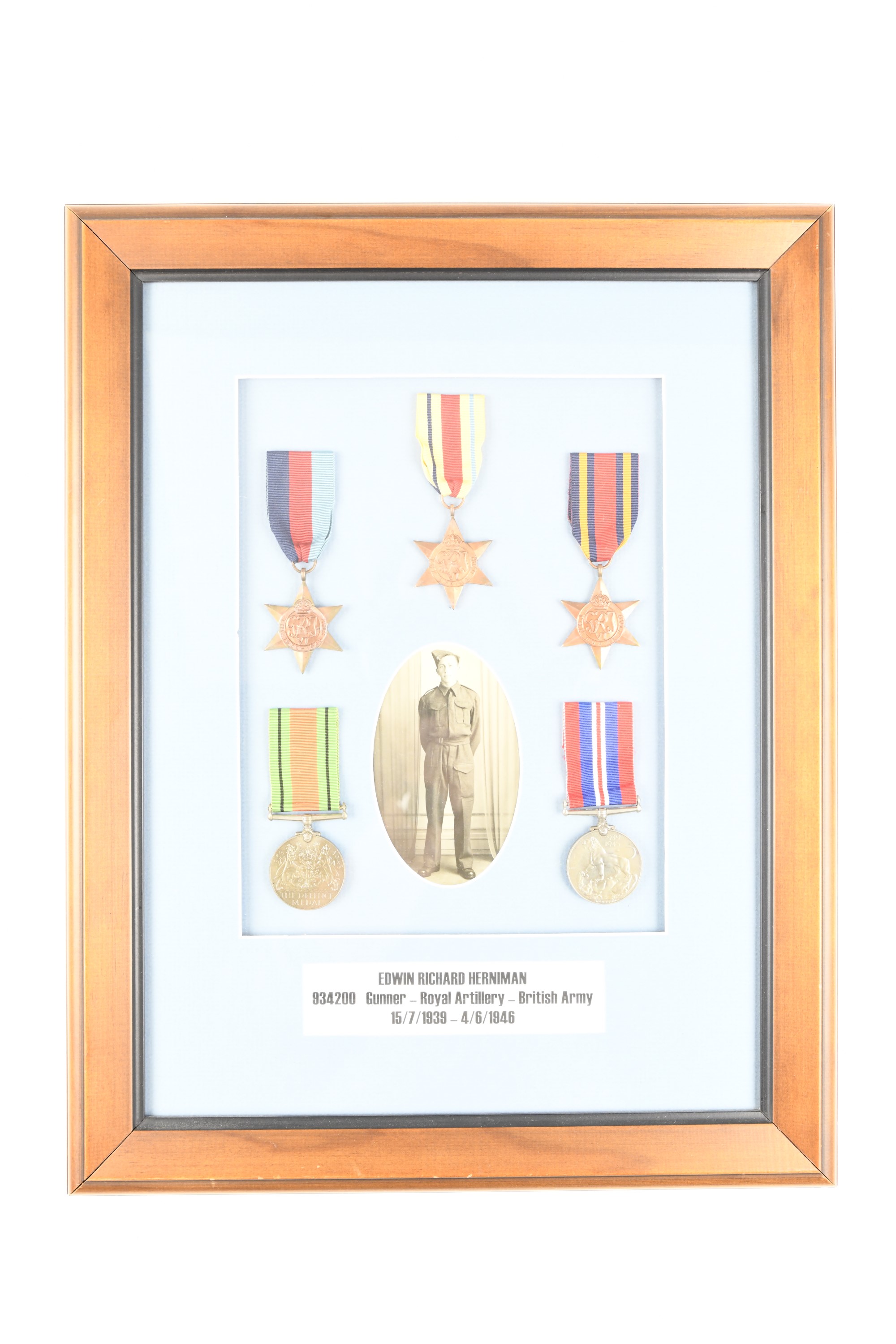 A framed Second World War campaign medal group including Burma Star, with portrait photograph,