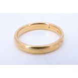 A vintage 18 ct gold wedding band, rubbed assay marks, 4.84 g, size N, 4.5 mm wide
