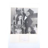 [ Autograph ] A Tommy Cooper signature, mounted in card with a photograph, 28.5 x 21 cm overall