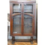 A George V glazed oak bookcase, having three adjustable shelves, 85 x 31 x 142 cm