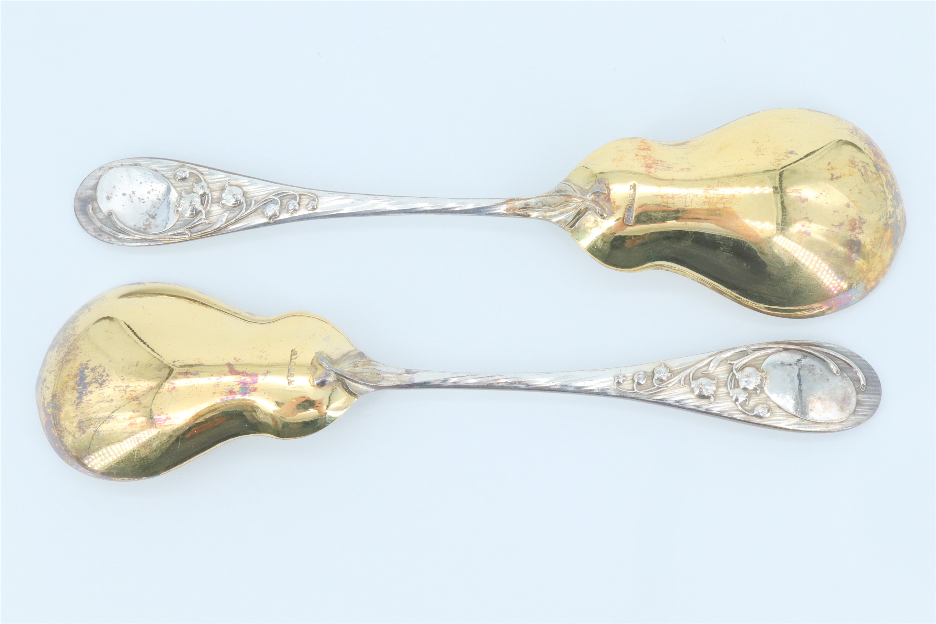 A cased pair of Belle Epoque German silver serving spoons, having pear shaped bowls, decorated - Image 3 of 4