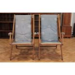 A near pair of vintage folding deck chairs, variously constructed in oak and beech, having