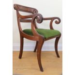 A Regency mahogany sabre leg carver dining chair, 87 cm high