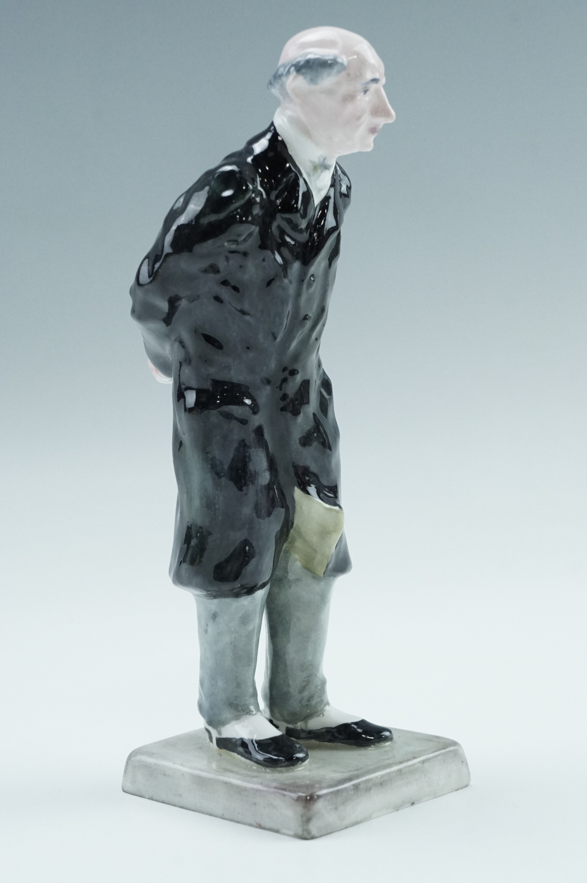 A Crown Staffordshire figurine of 'Mr Pecksniff', the Dickens' character from Martin Chuzzlewit,