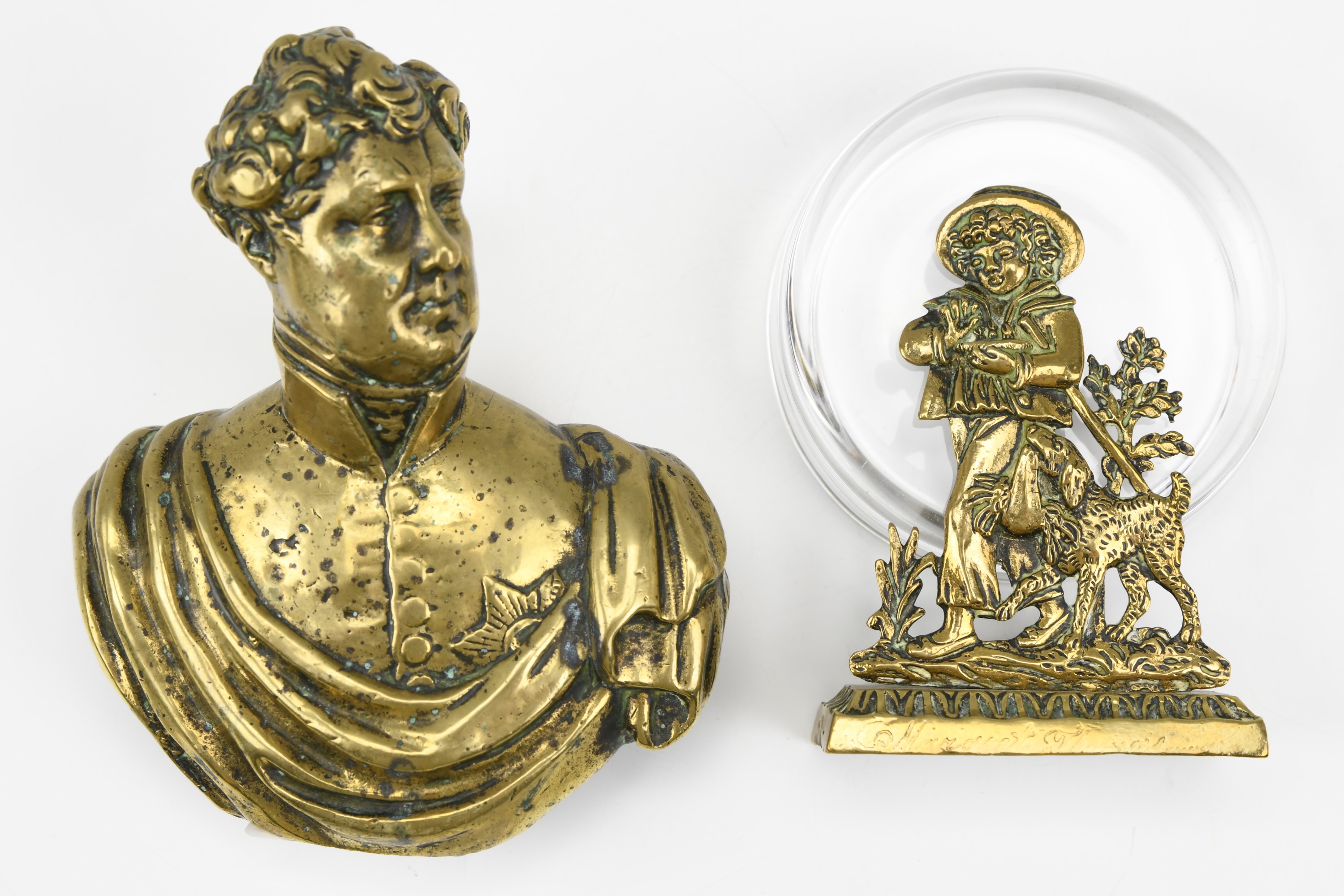 A cast brass bust of King George IV, circa 1820-1830, (lacking socle), 12.5 cm, together with a