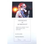 [ Autograph ] An Elton John signed photograph , mounted on card, with certificate, overall 21 x 30