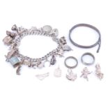 A late 20th Century white metal and electroplate charm bracelet, together with five loose