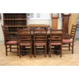 A set of eight quality reproduction oak ladder back dining chairs, retailed by Chapman's, and an oak