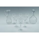 A decanter together with six small wine glasses and a carafe, decanter 18 cm,