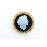 A Victorian moulded glass and 9 ct yellow metal cameo, being a classical maiden, bezel set with a