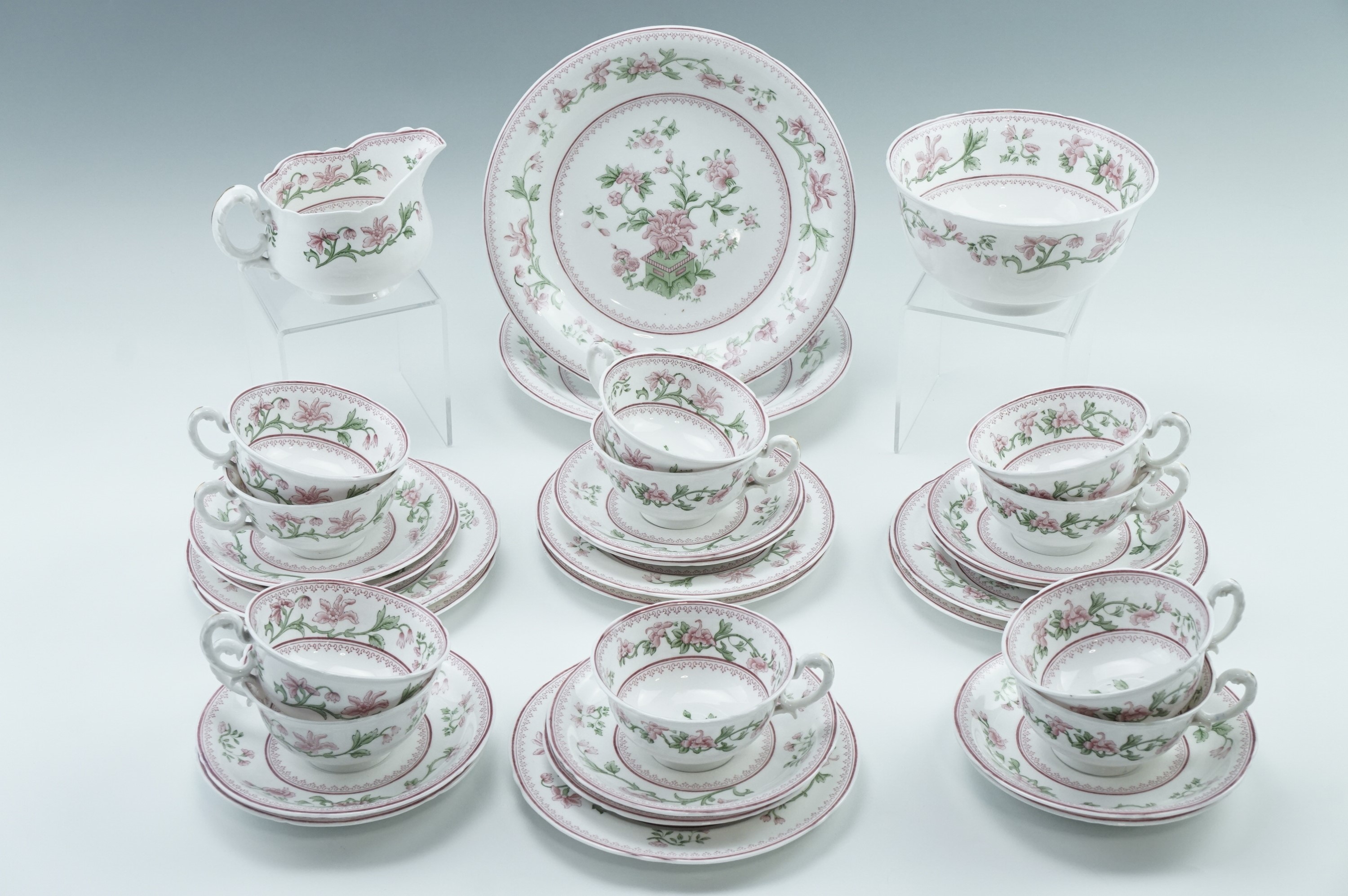 A Royal Worcester tea set decorated with stylized peonies, approximately thirty five items, (one cup