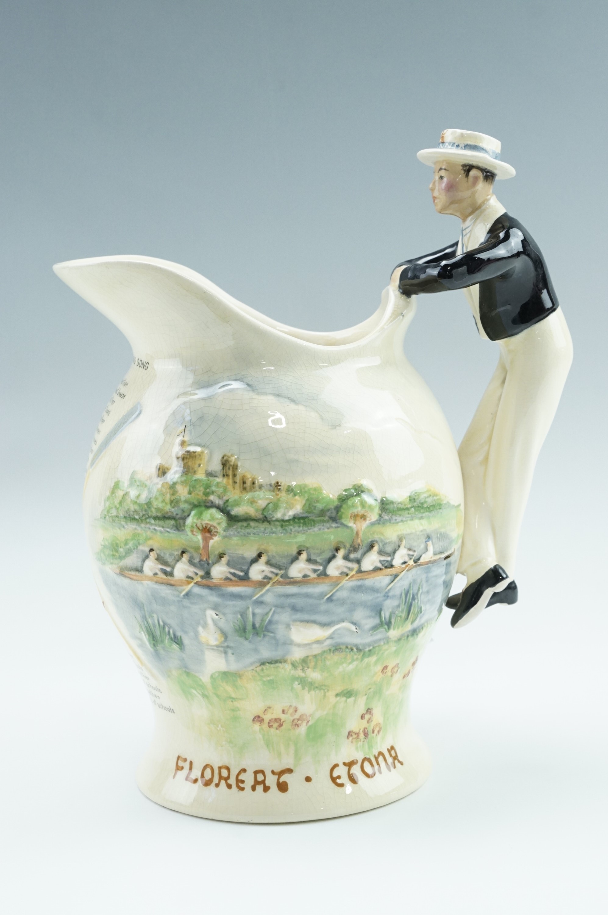 A 1920s Fielding's Crown Devon musical jug, having a handle modelled as a boatman, the outside