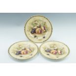 Three Aynsley Orchard Gold cabinet plates, transfer decorated with fruit, late 20th Century, 26.6