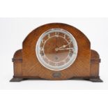 A 1950s oak veneered mantle clock, the movement marked Garrard , 36 cm x 11 cm x 23 cm