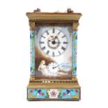 A early 20th Century French brass and enamel repeating carriage alarm clock, the key wind and set