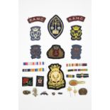 Sundry items of insignia including a Merchant Navy officer's cap badge, a Second World War Dutch