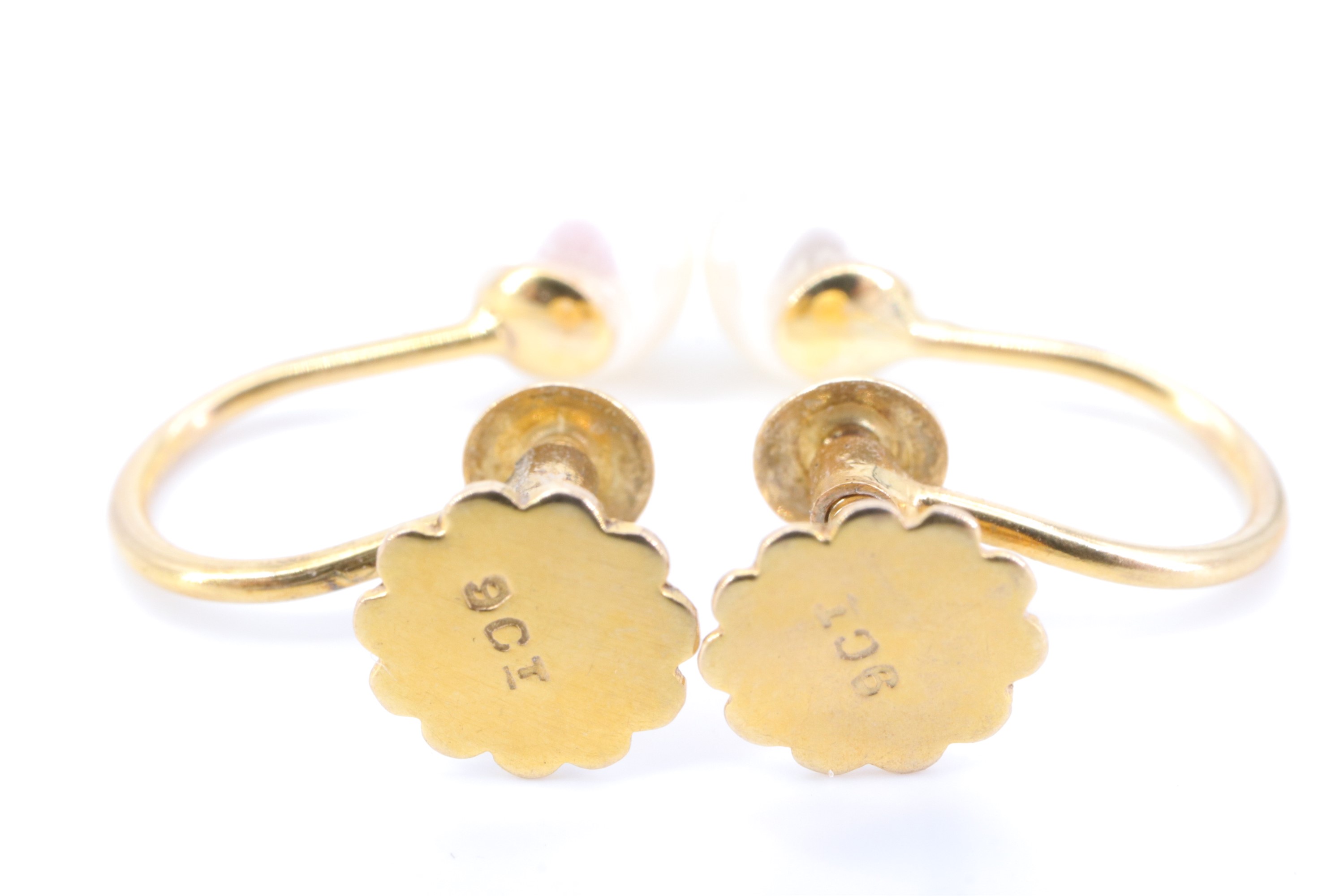 A pair of mid 20th Century pearl and 9 ct yellow metal earrings, having screw-backs marked '9ct', - Image 2 of 2