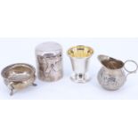 Sundry items of small silver comprising a Victorian cream jug, a salt cellar, a spirit heater /