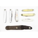 Six pocket knives including a Silver Jubilee 1952-1977 commemorative example