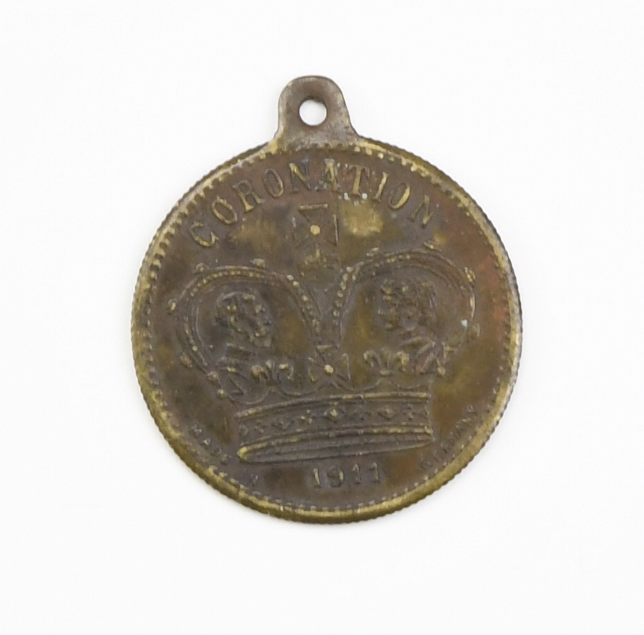 A 1911 Barratt & Co confectioners copper coronation commemorative medallion bearing the legend "