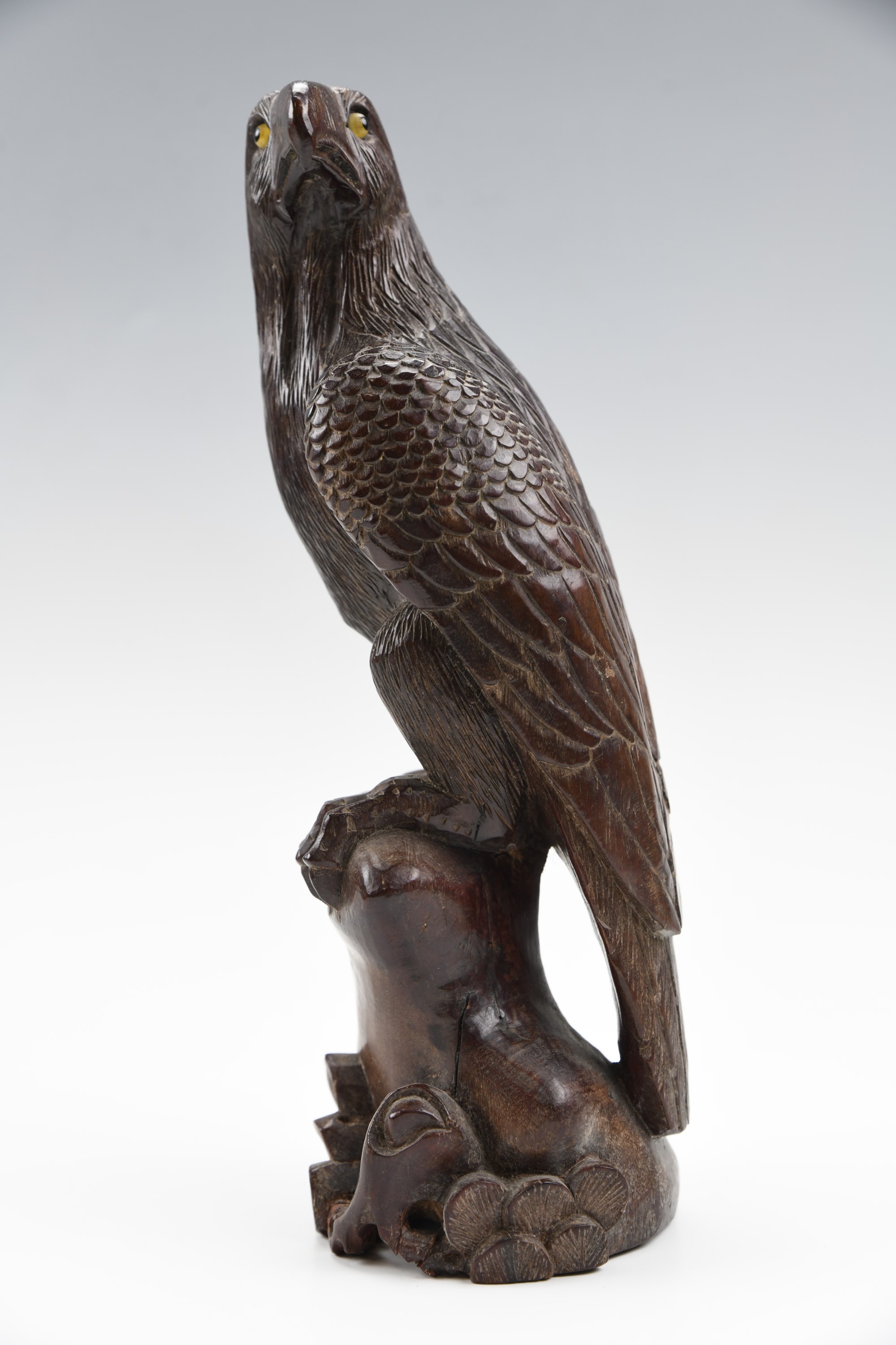 A Japanese carved wooden figure of a perched eagle, having glass eyes, late 19th / early 20th - Image 2 of 3