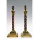 A pair of vintage copper and brass columnar table lamps, having Corinthian capitals and Solomonic