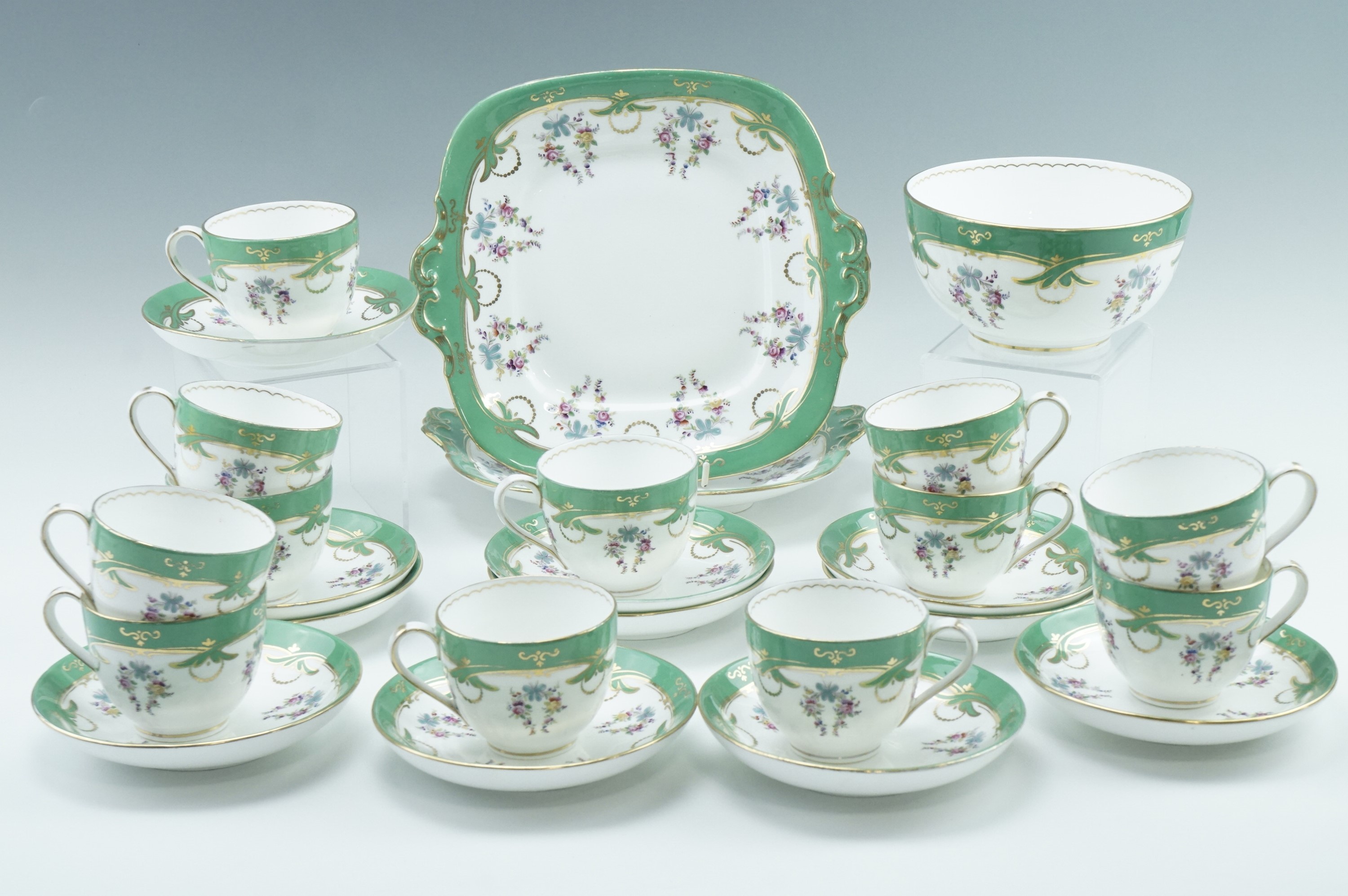 A Victorian tea set, in white and green having gilt and floral decoration, comprising 12 cups, 12